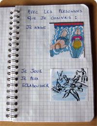 Carnet à anneaux dans lequel sont collés des images et écrit des règles